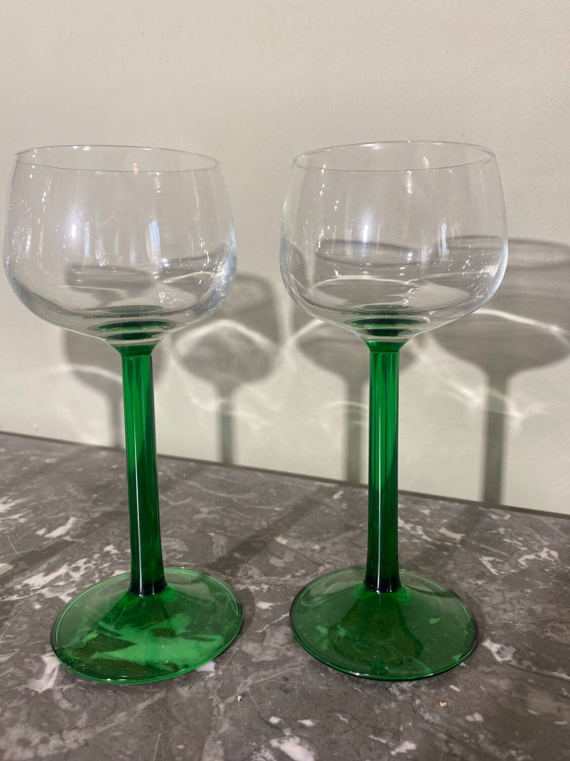 4 green stemmed glasses