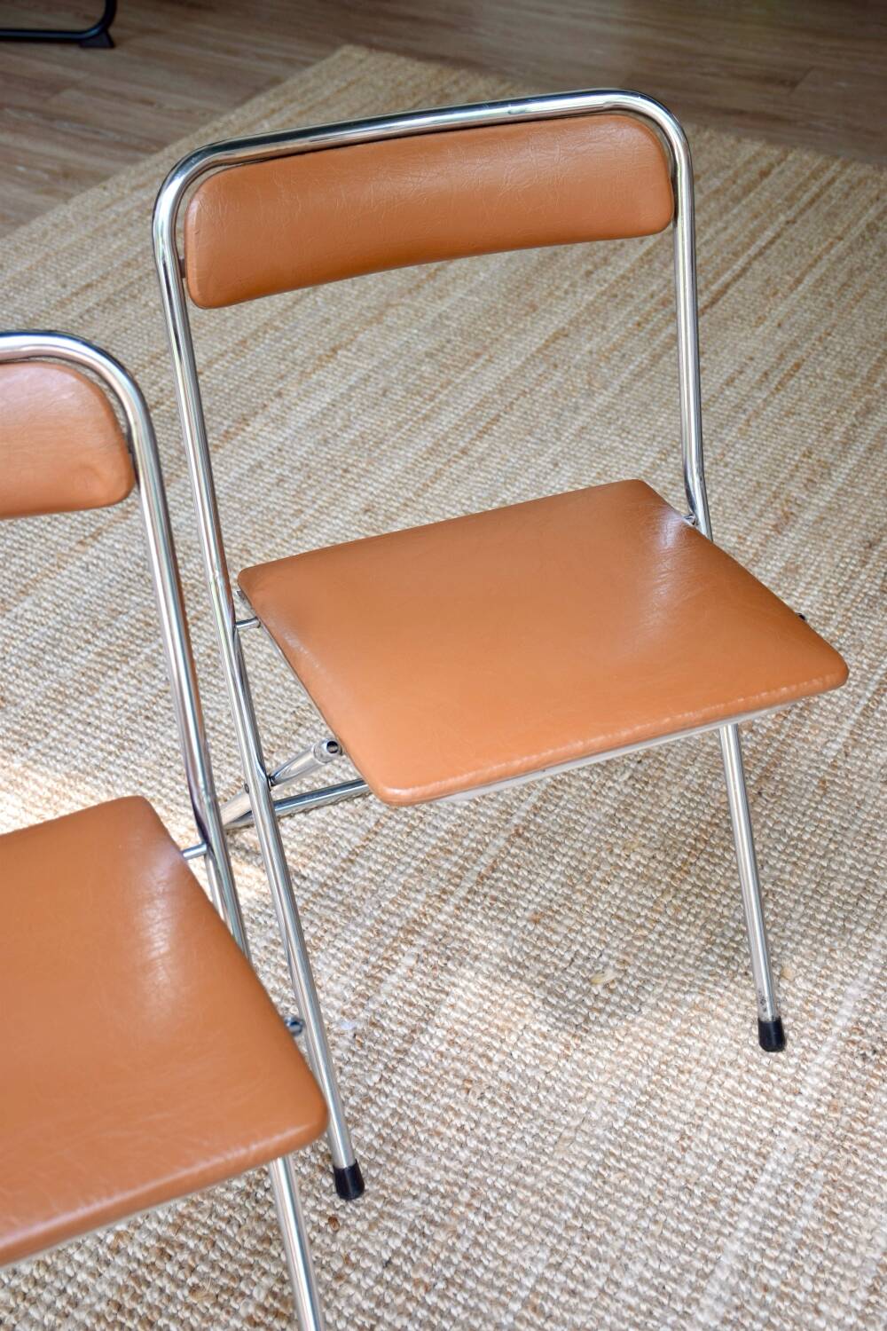 Pair of “Soudexvinyl” folding chairs in skai and chrome tube