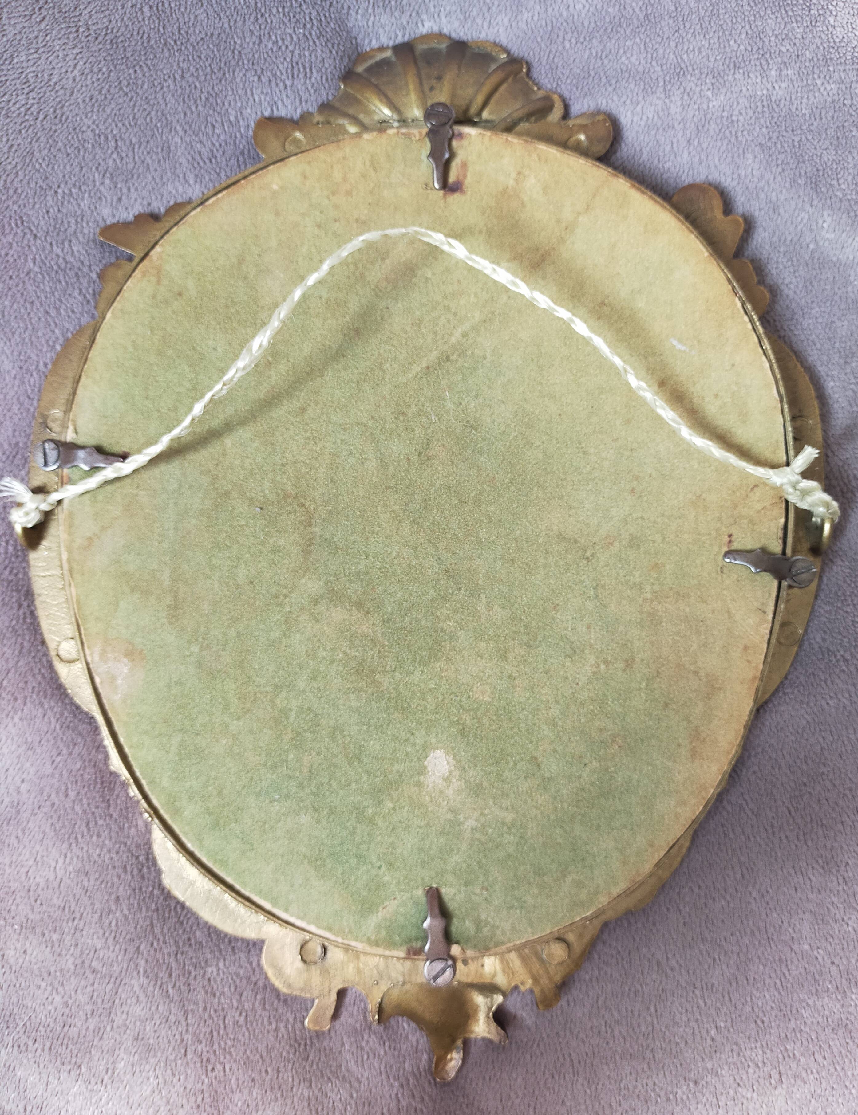 Gilded bronze mirror with angel ornament
