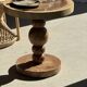 Coffee table in solid suar with central leg and spheres H56.5 D55.5