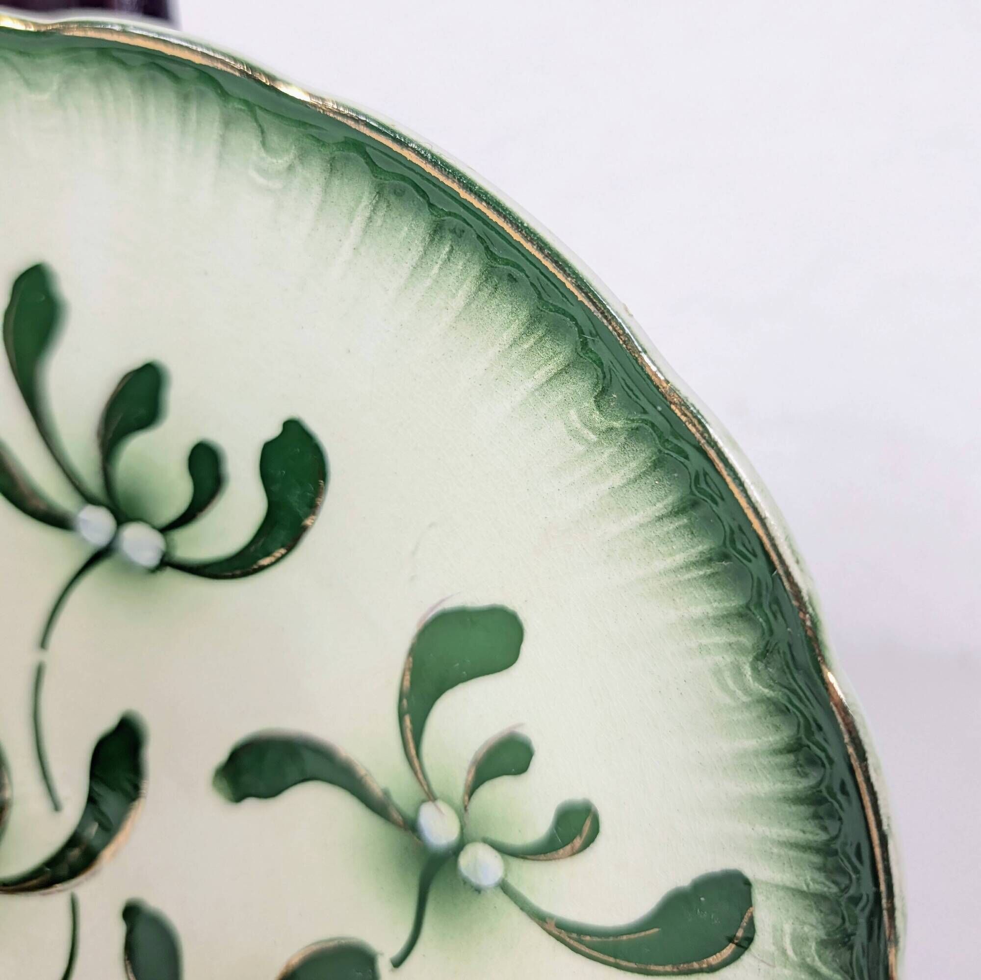 Badonviller plate with a guilloche pattern, green slipware.