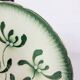 Badonviller plate with a guilloche pattern, green slipware.
