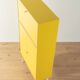 Classic sideboard from the 1960s, oak veneer, yellow Resopal, white steel feet