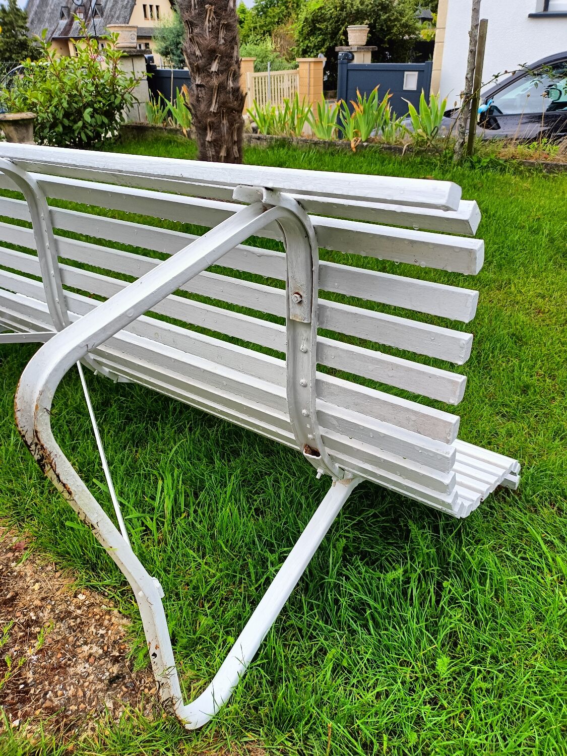 Antique garden bench with metal legs