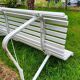 Antique garden bench with metal legs
