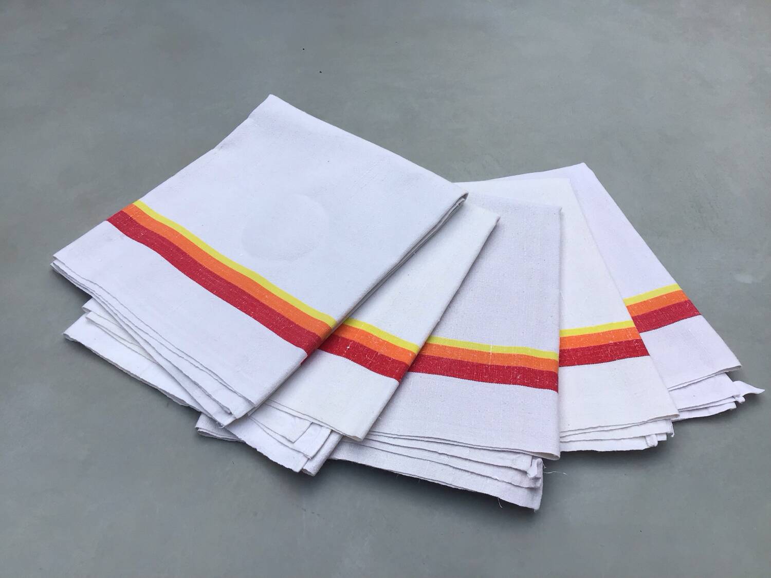 5 old tea towels in ecru linen with orange, red and yellow stripes