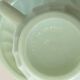 Tasse à thé et soucoupe en opaline vert menthe à motif tourbillon, fabriquées en France