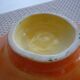 Yellow and orange ceramic salad dish