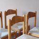4 solid pine chairs, straw seats, shaped backrest.