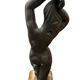 Ceramic statue with a wooden base after Giraud.