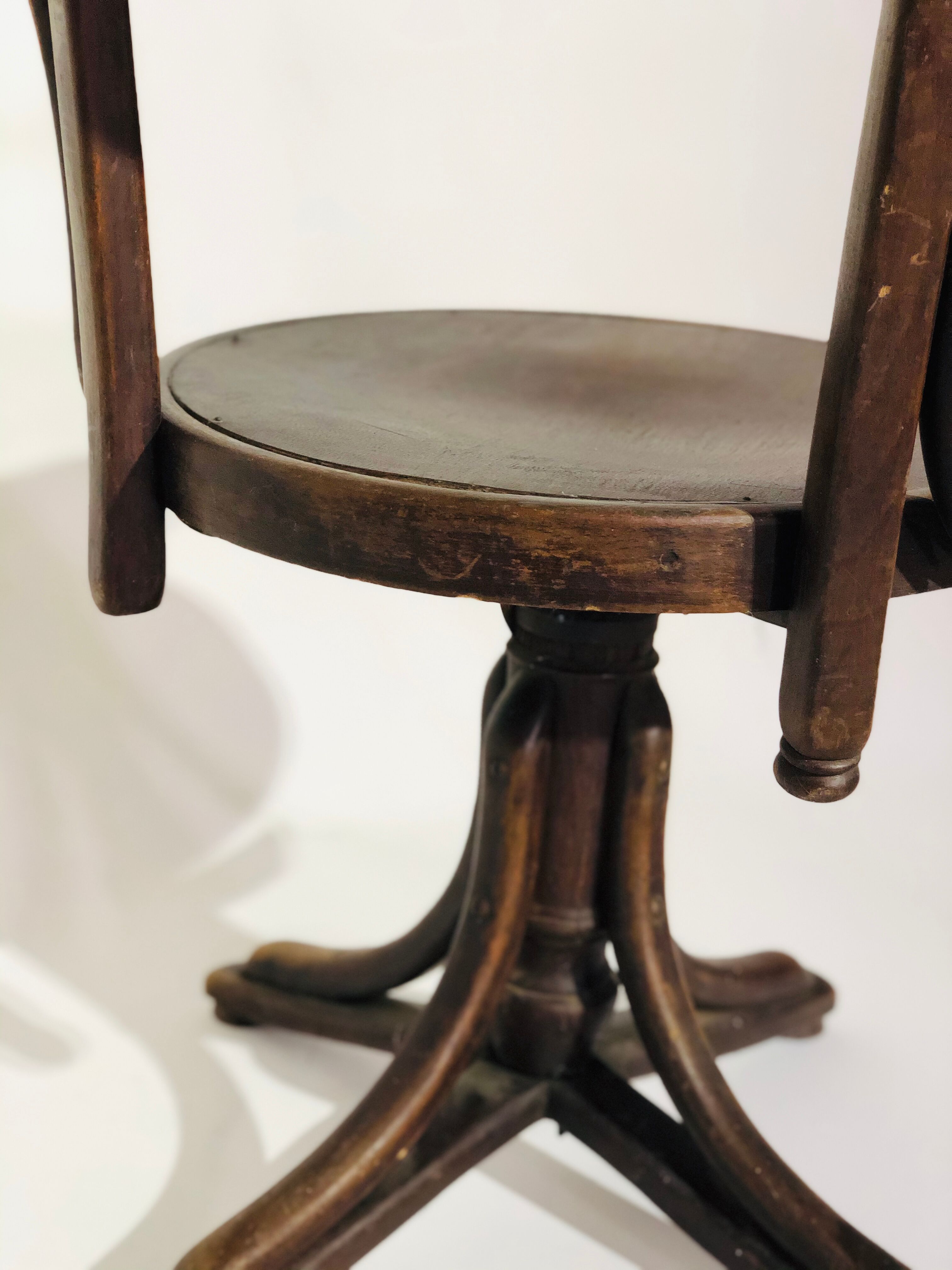 Swivel wooden armchair