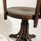 Swivel wooden armchair