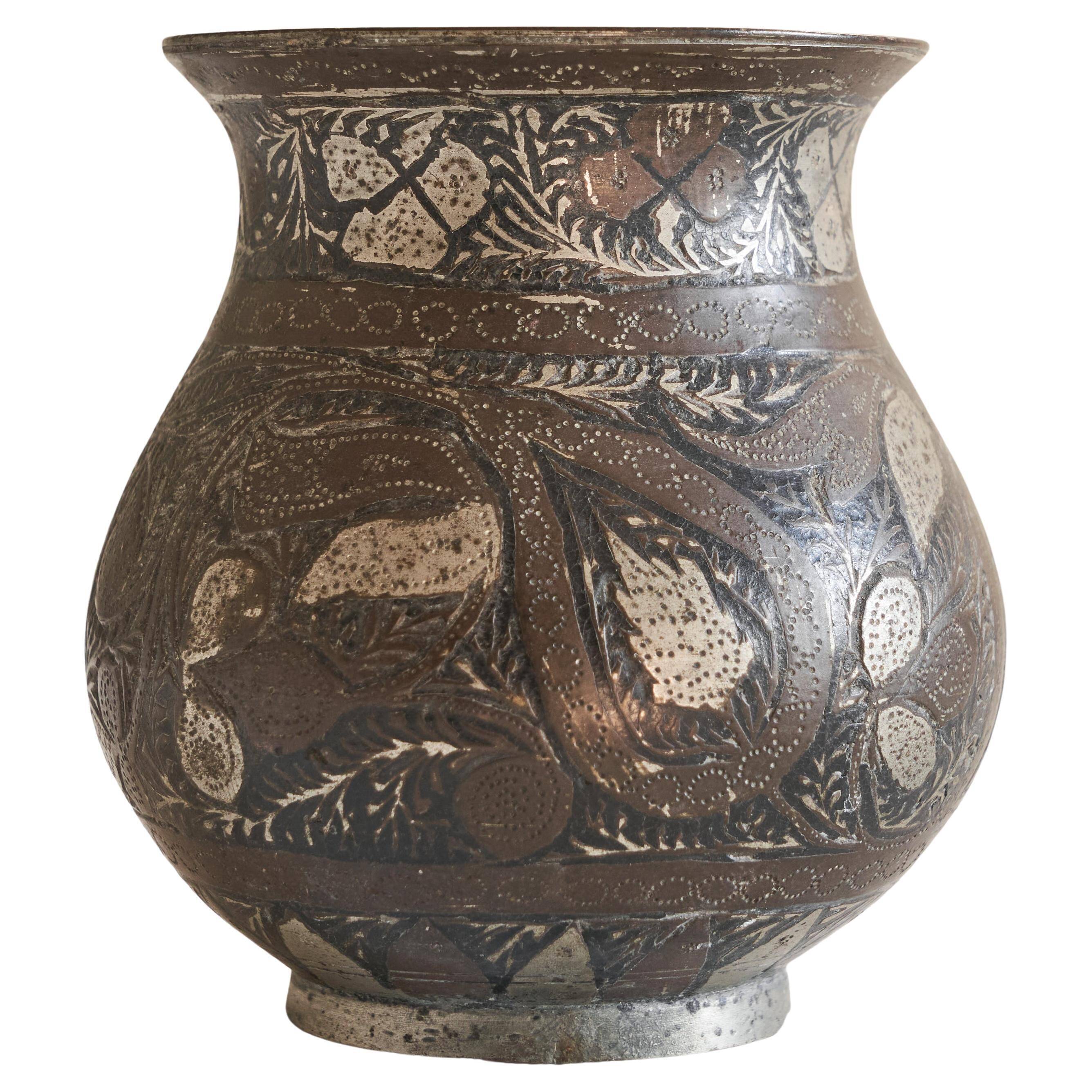 Antique pyriform Bidri vase in the shape of a pyramid.