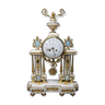 A beautiful white marble portal table clock with gilding ornaments at the fire.