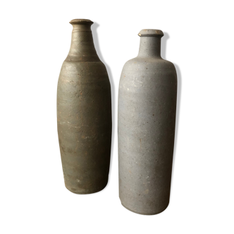 2 old sandstone bottles