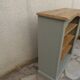 Green-grey library, wooden shelf and shelves in natural wood.