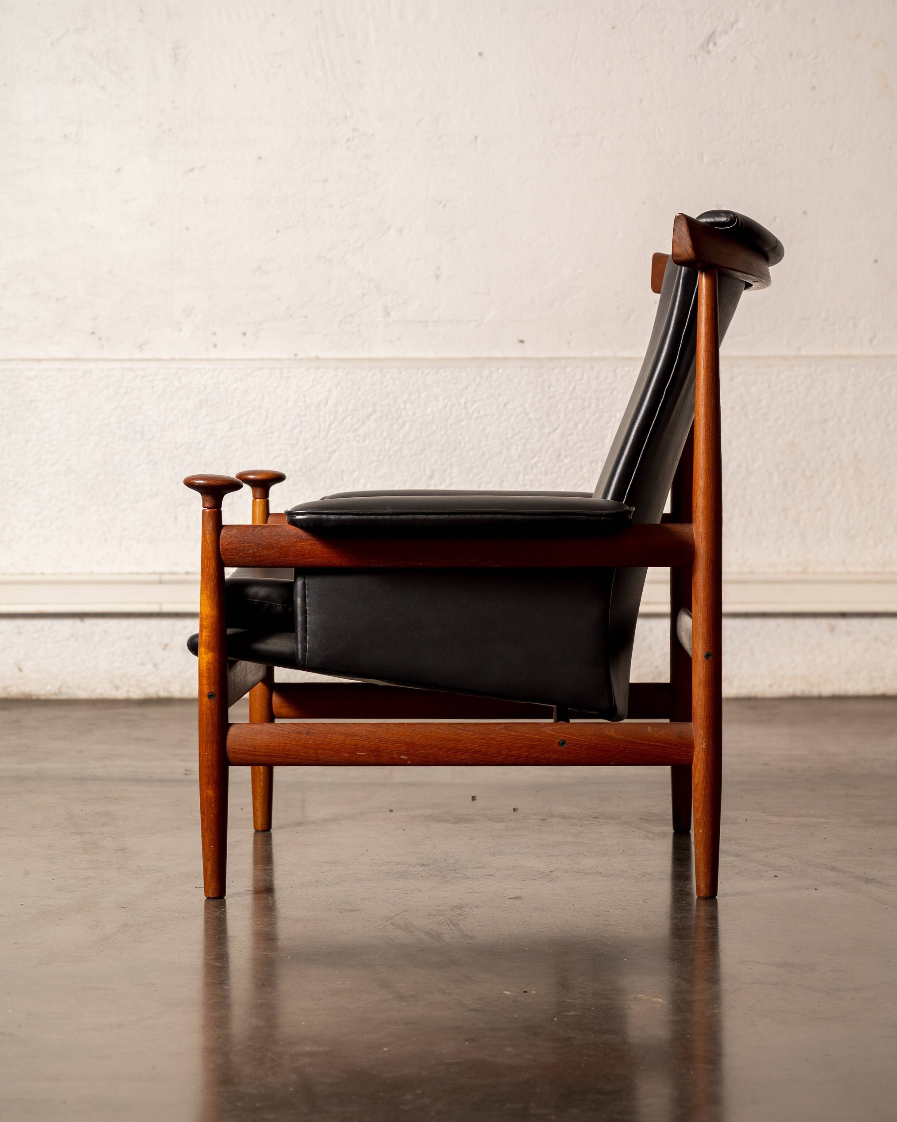 Finished Juhl armchair and its ottoman.