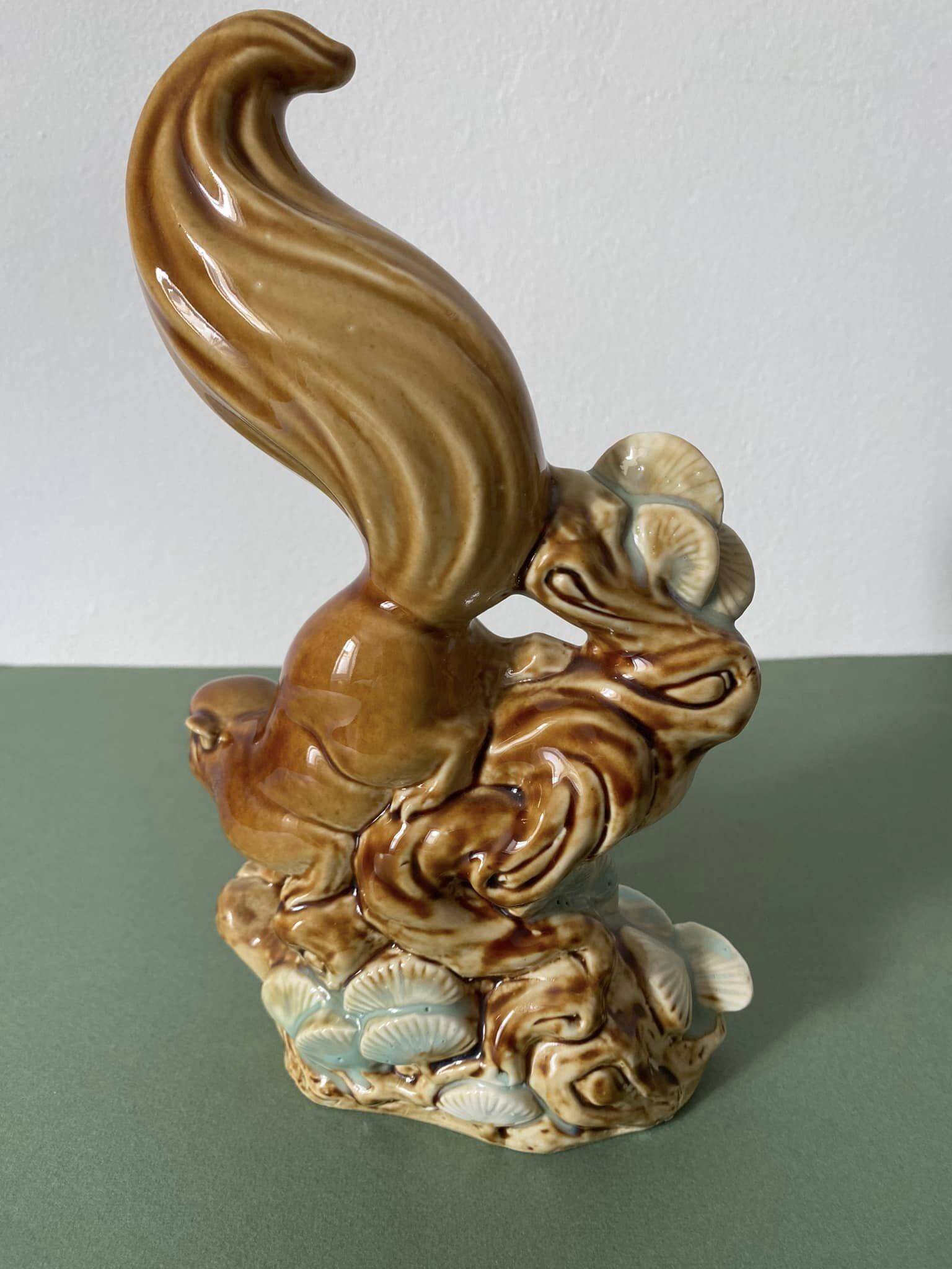 Ceramic squirrel on branch
