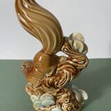 Ceramic squirrel on branch
