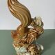 Ceramic squirrel on branch