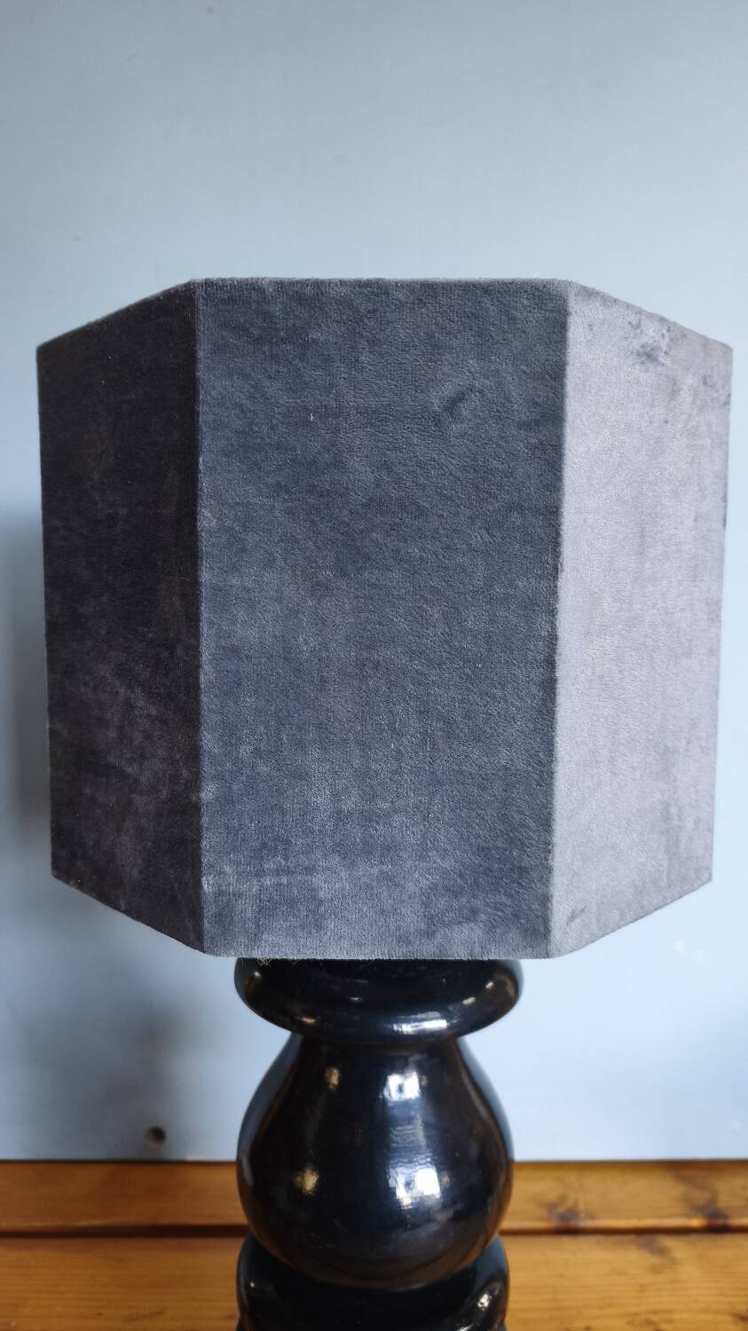 Sculptural table lamp made of turned wood