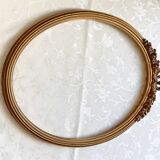 Oval frame with gilded pediments 19th wood and stucco