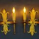 Pair of electrified golden wrought iron gothic wall sconces.