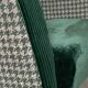 Retro armchair from around 1960 in forest green with houndstooth pattern.
