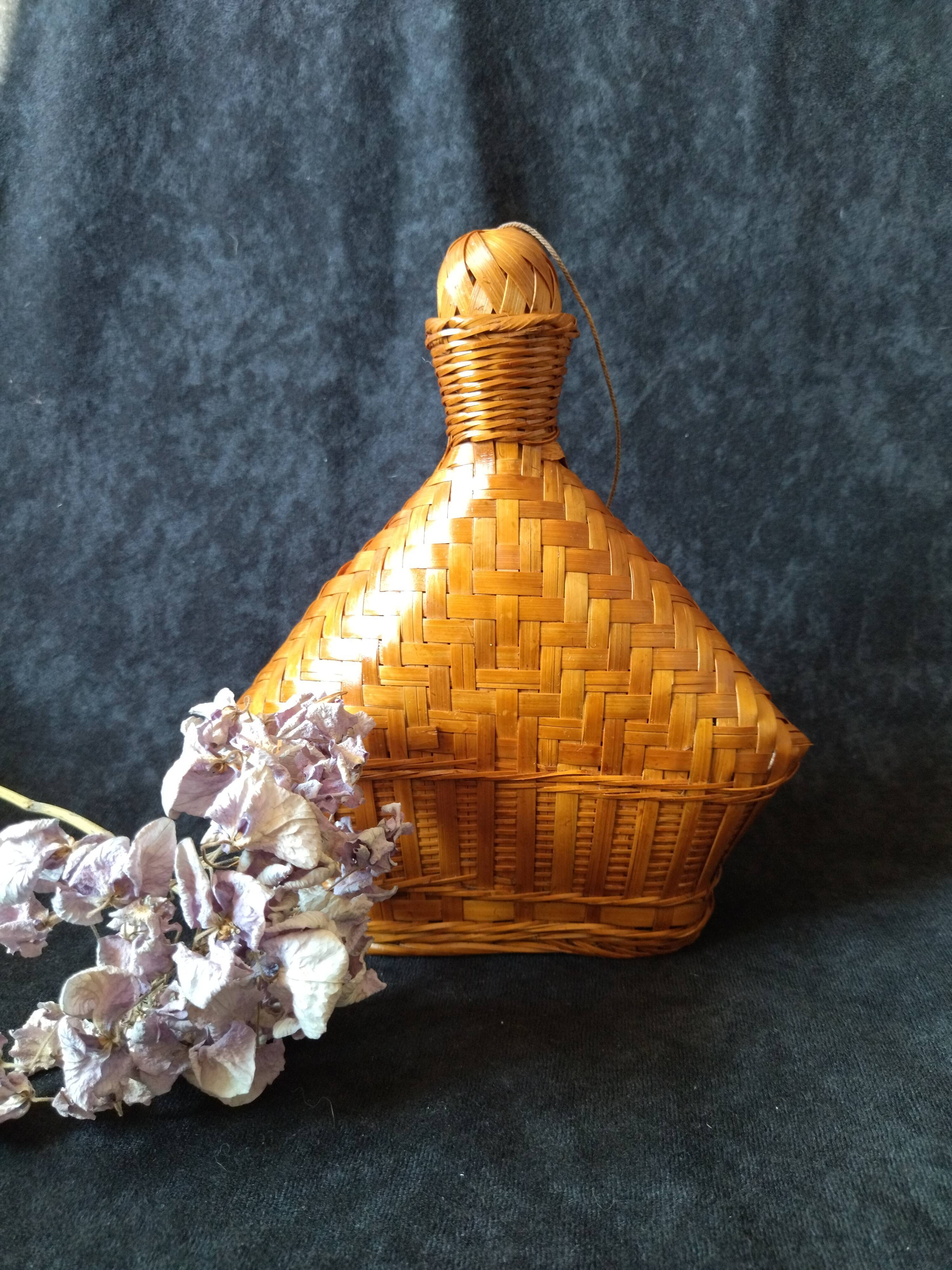 Vintage wicker and braided bamboo bottle