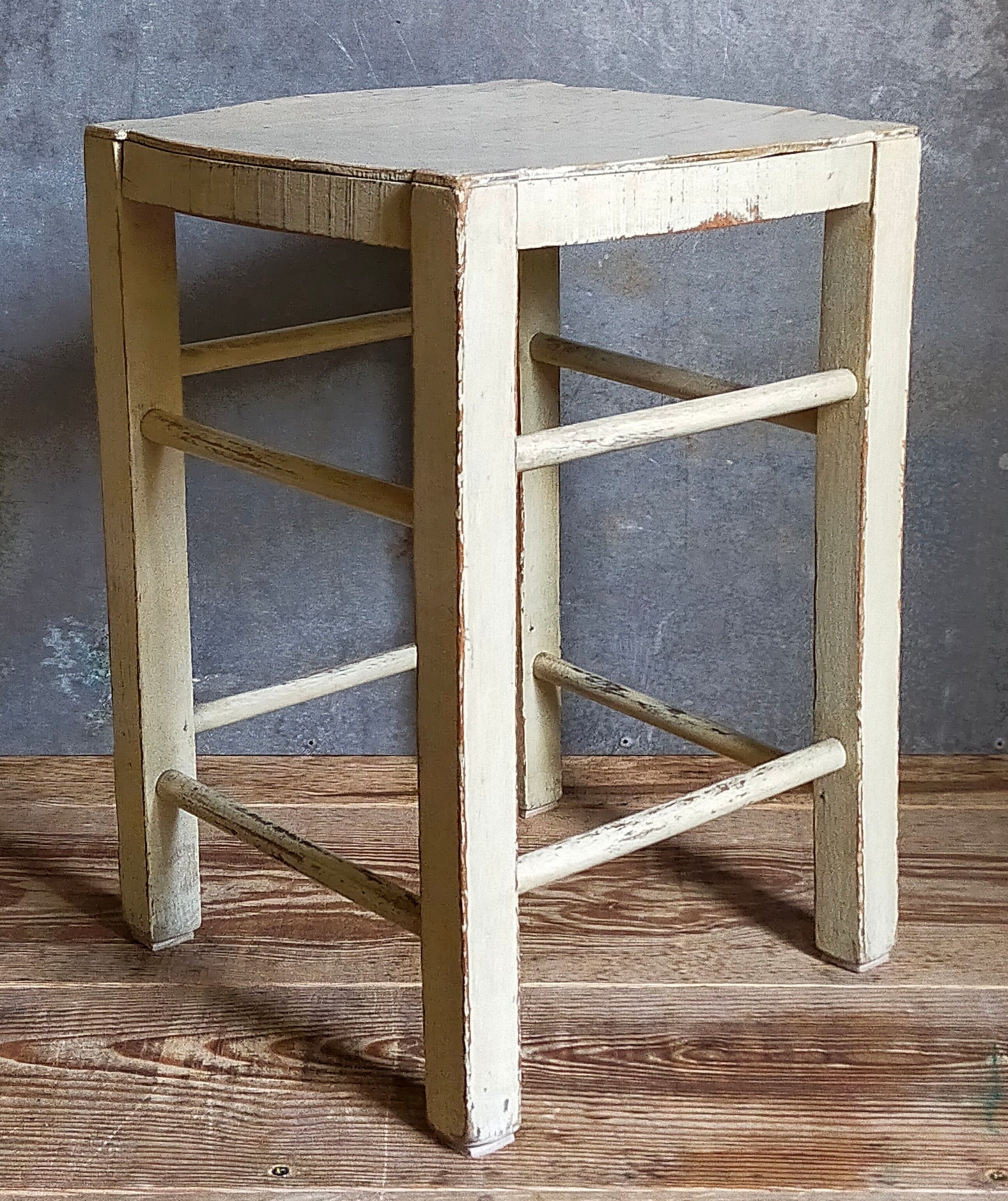 Old patinated painted wooden stool
