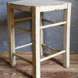 Old patinated painted wooden stool