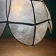 Vintage pendant light in mother-of-pearl and brass.