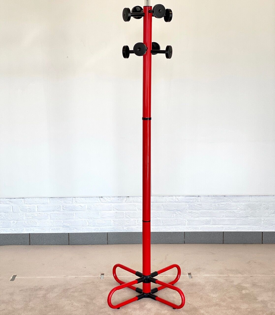 Vintage red metal coat rack