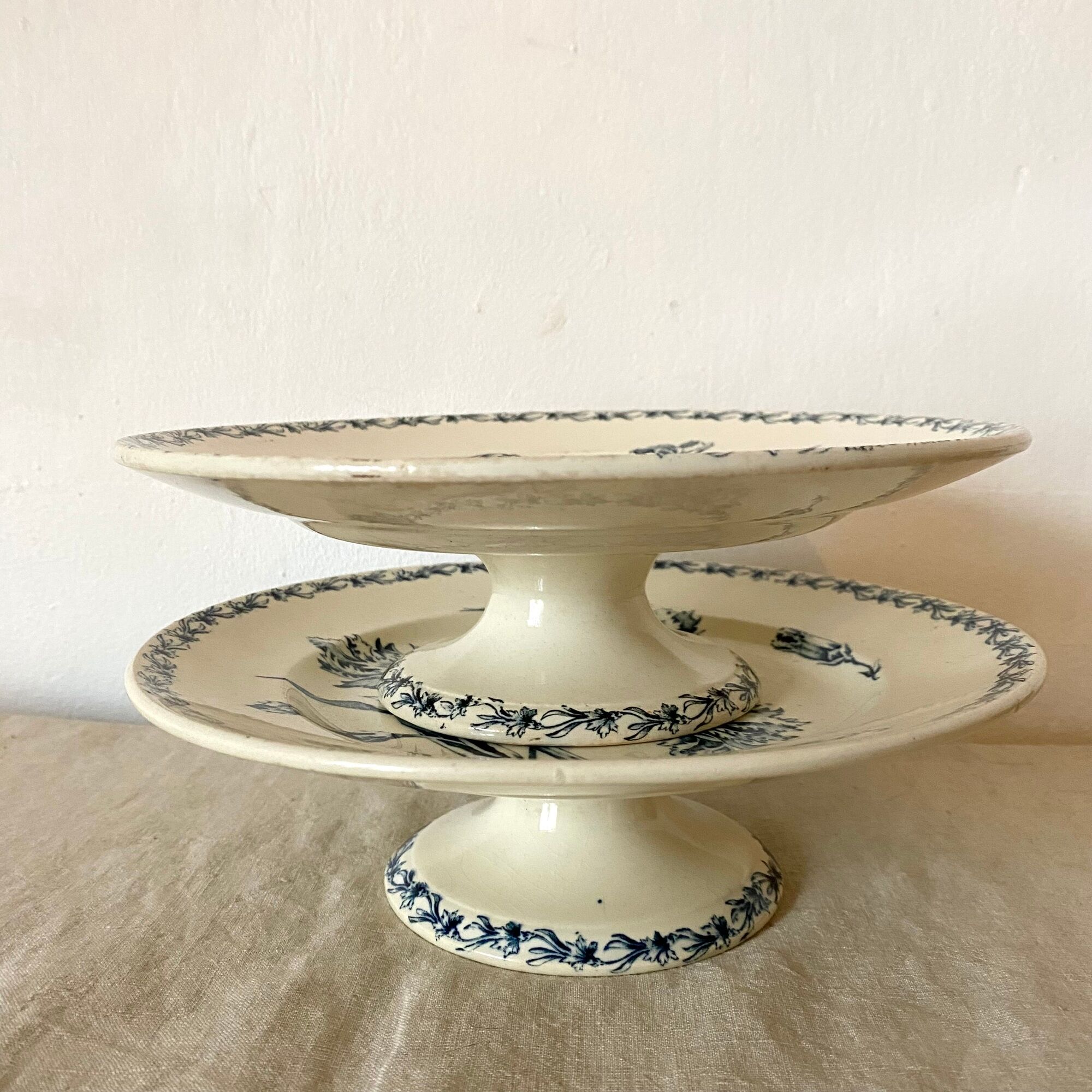 Antique dishes on foot in Luneville carnation porcelain