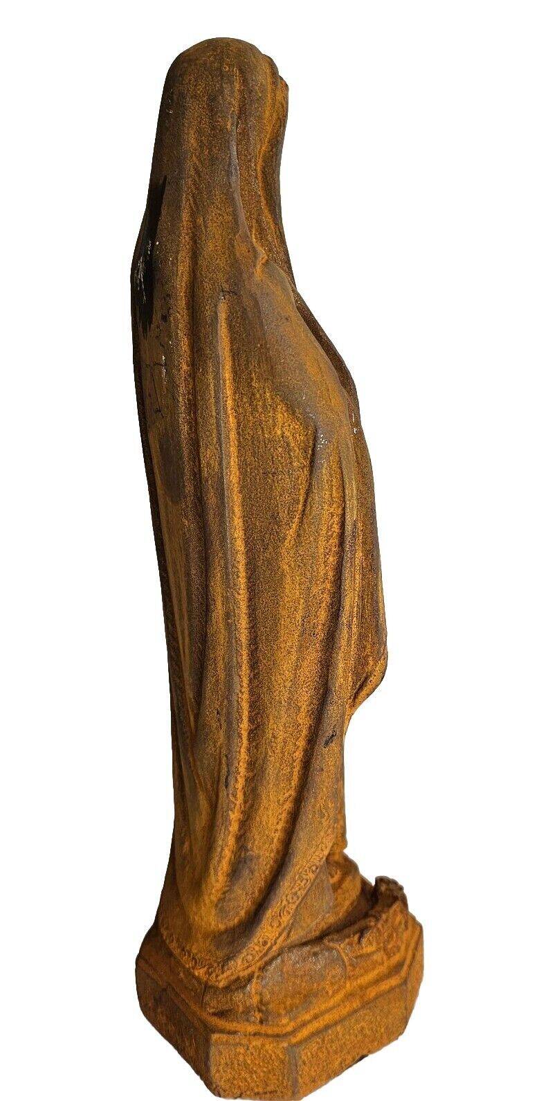cast iron statue of the virgin
