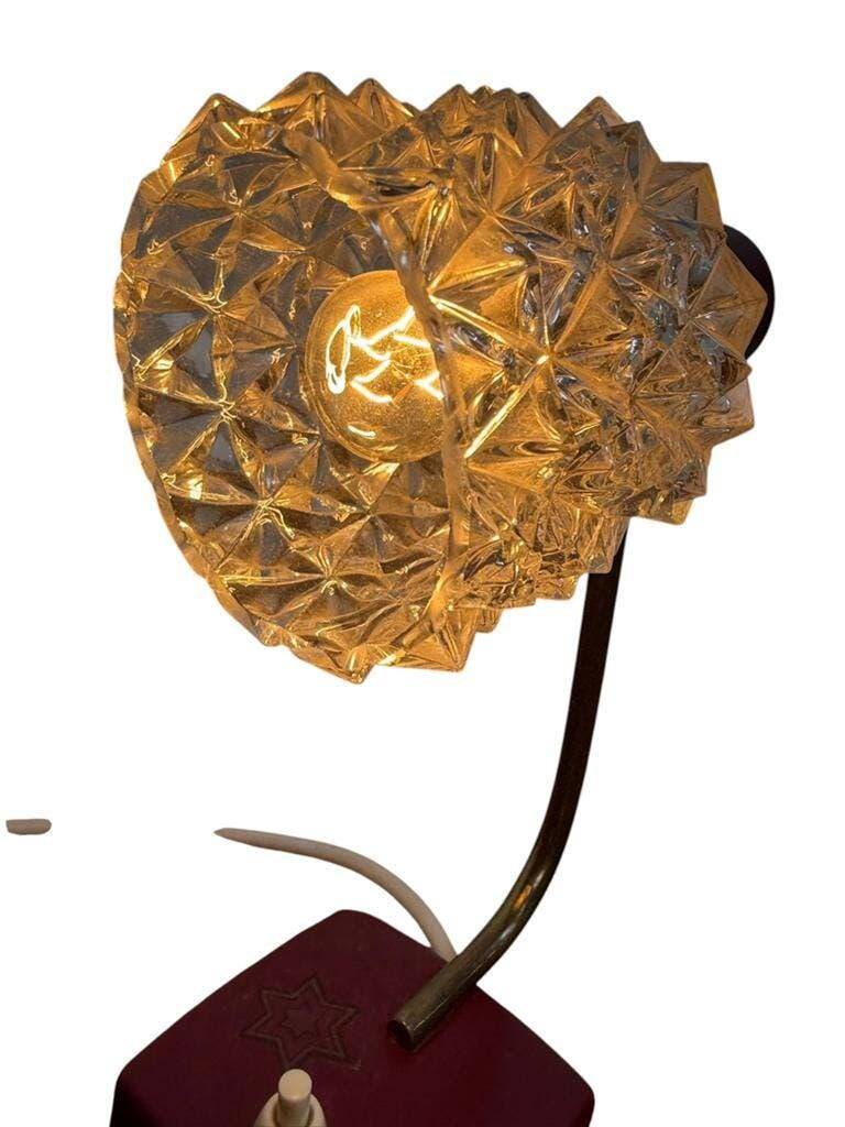 Vintage burgundy table lamp with glass shade.