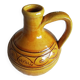Round ochre glazed jug with handle
