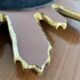 Vintage sun mirror in golden resin 60s/70s