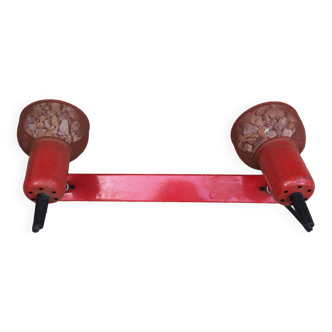 Old industrial wall light in red metal.