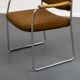 Fauteuil, années 1960, structure en métal chromé, accoudoirs en teck