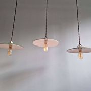 Trio of large industrial suspensions in green enamelled sheet metal.