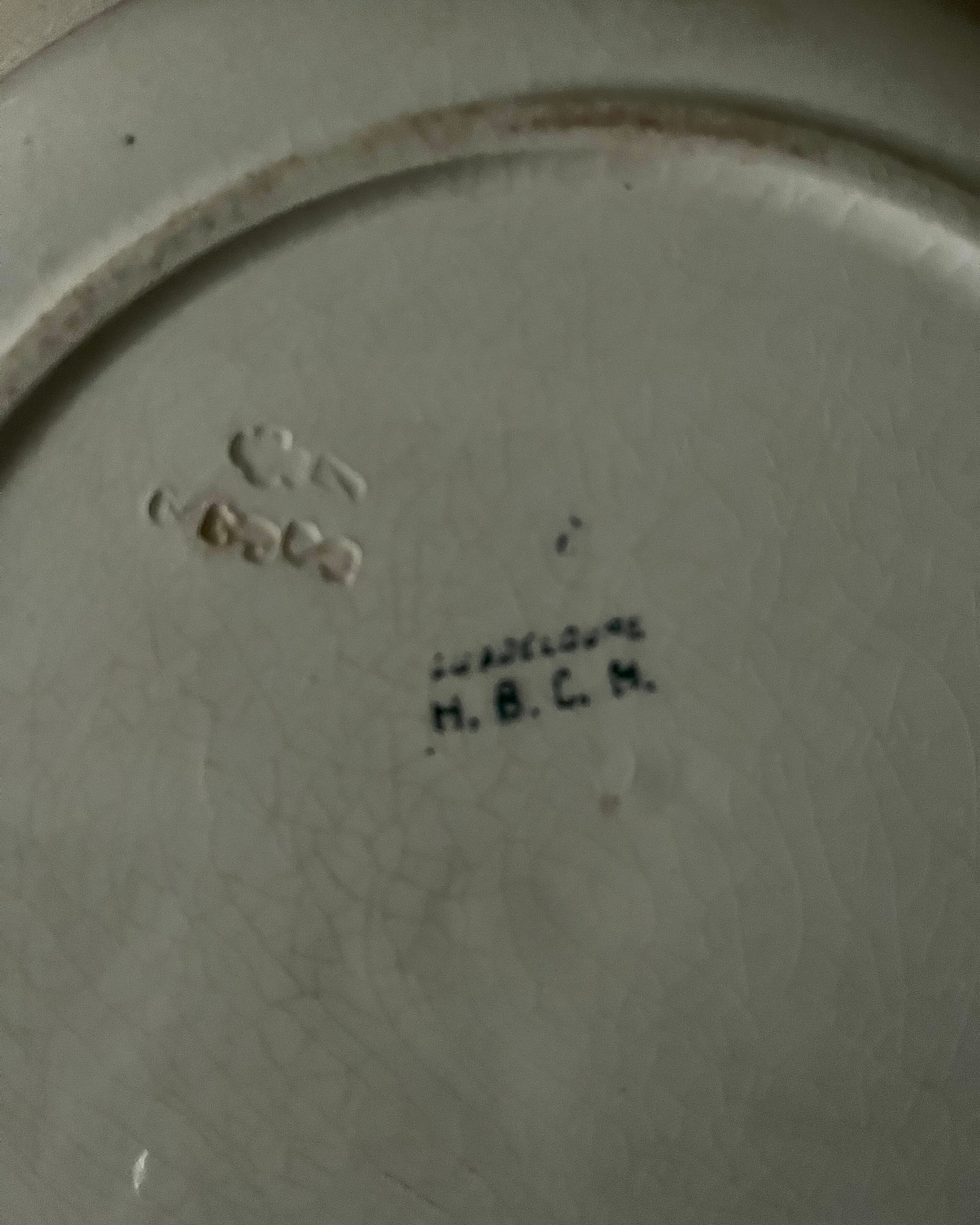 Shallow round plate from Saint Amand ironstone.
