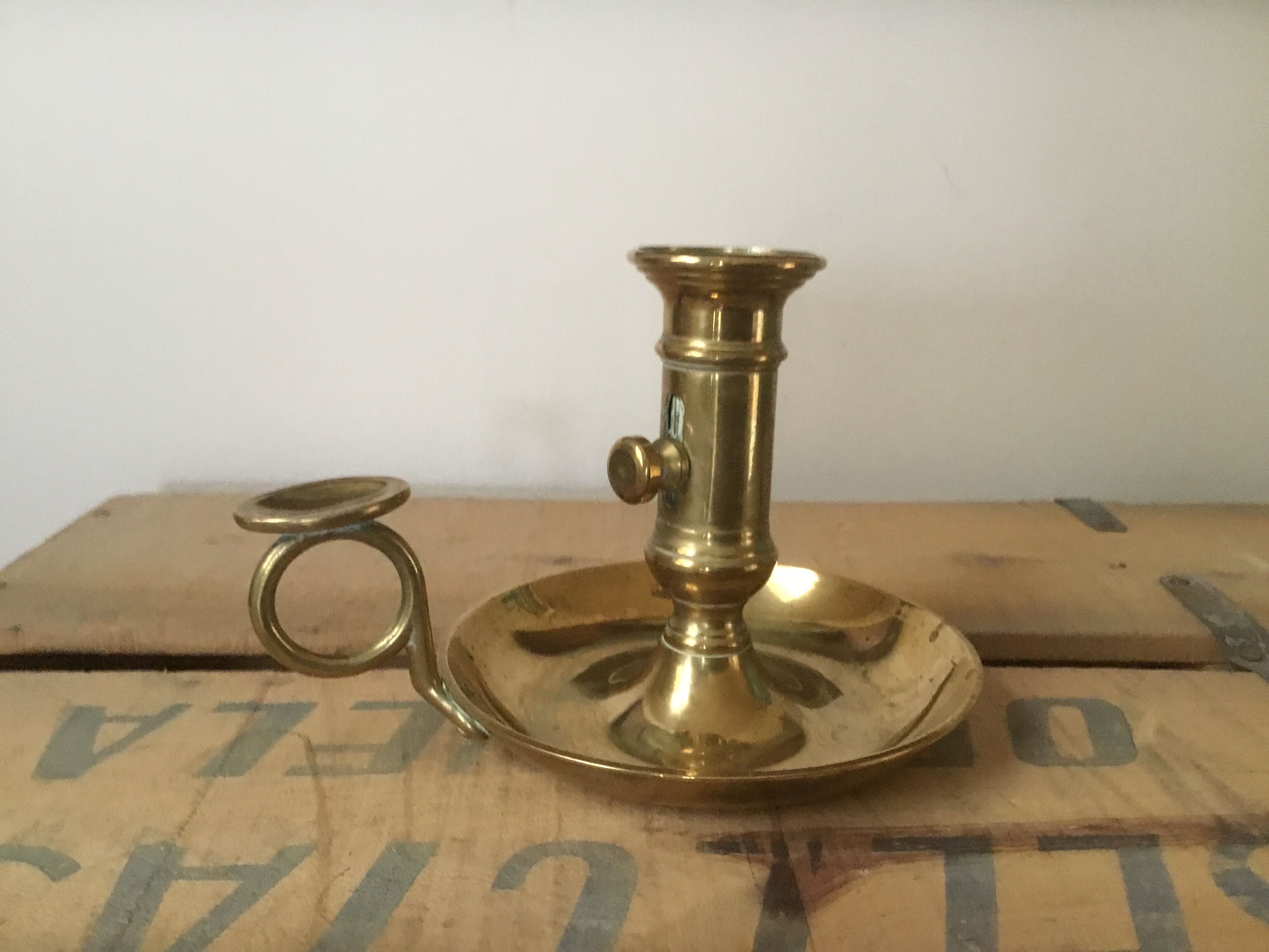 Thumb brass candlestick