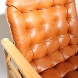 Upholstered leather armchairs 70s