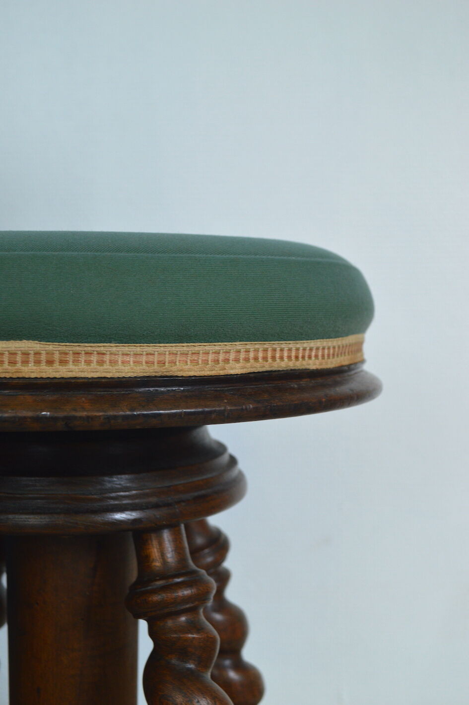 Antique piano stool with adjustable screws and turned wooden legs