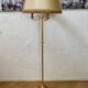 Lampadaire tripode en métal doré