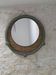 Round decorative mirror in sage green and rattan – Chic country style