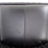 Pair of black woven leather lounge chairs