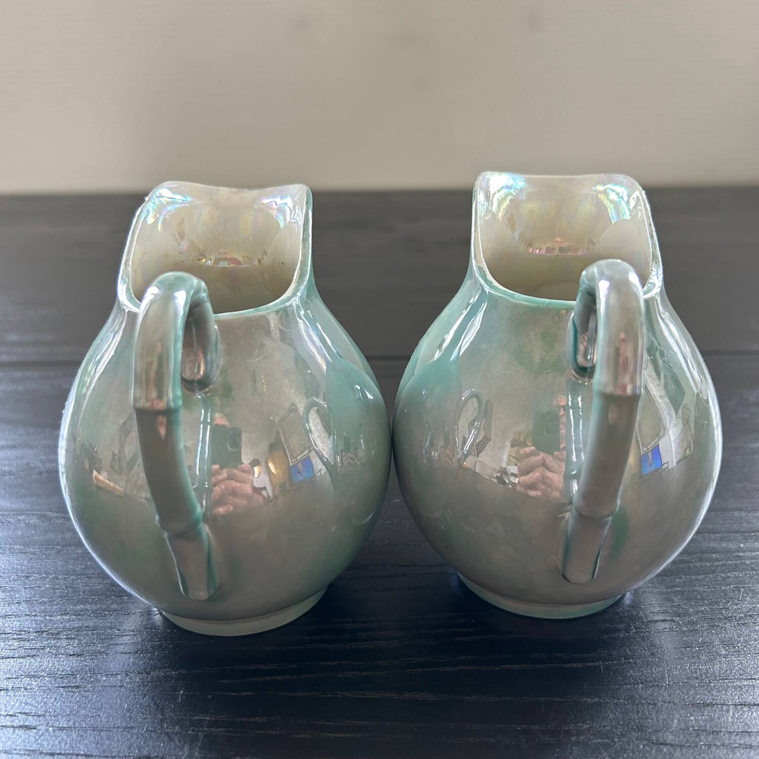 Pair of iridescent blue pitchers