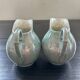 Pair of iridescent blue pitchers
